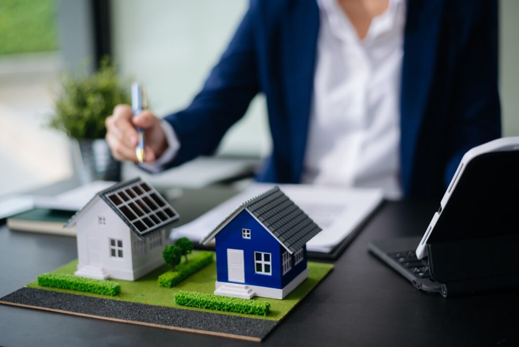 balancing the property sector The real estate agent is explaining the house style to see the house